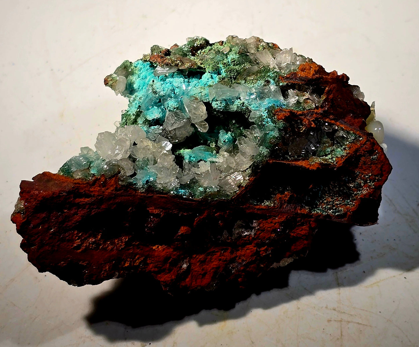HEMIMORPHITE WITH MULTIPLE COPPER MINERALS ON LIMONITE (small cabinet)