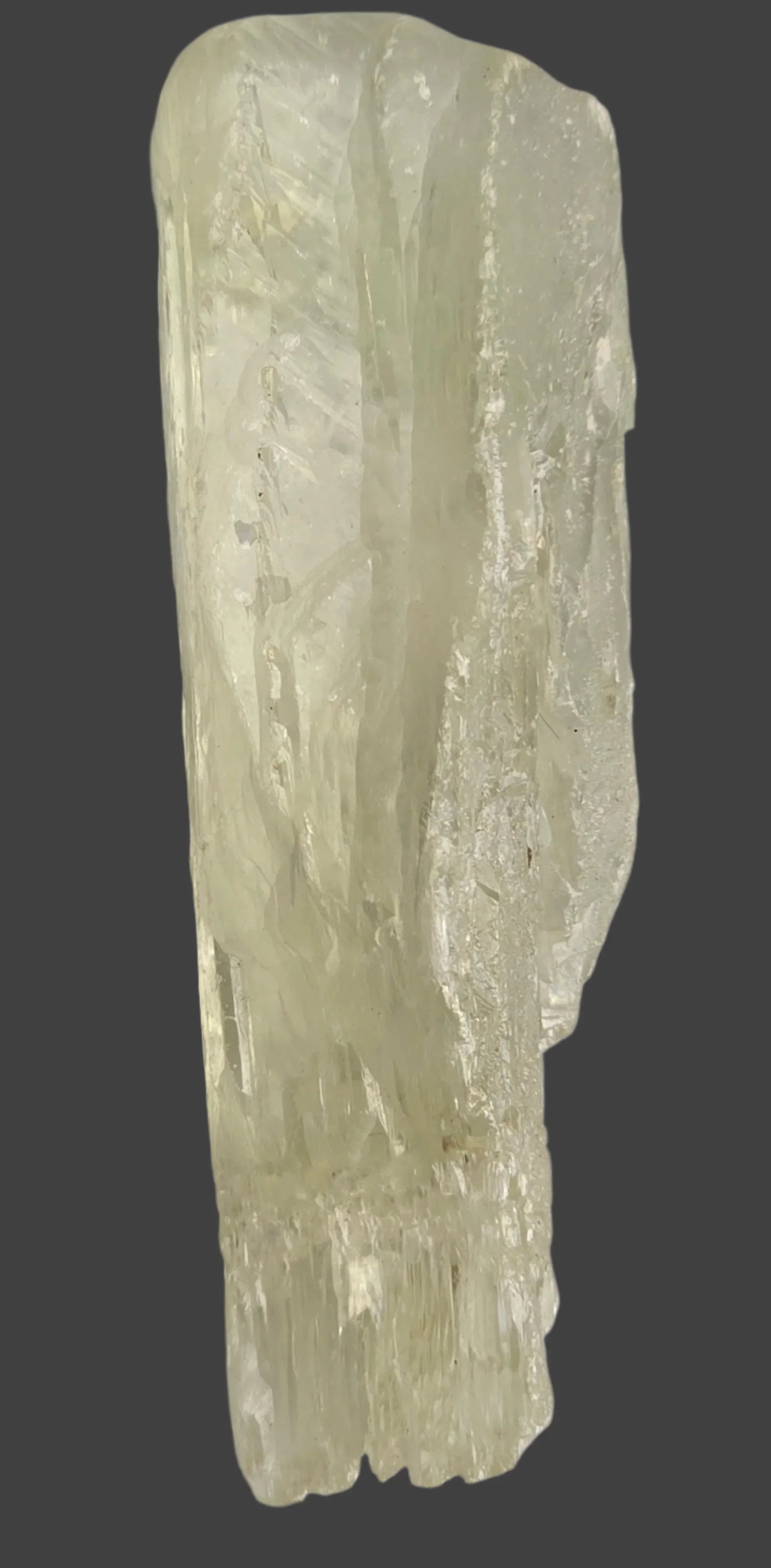 Calcite crystal specimen with striated texture, natural mineral for collectors