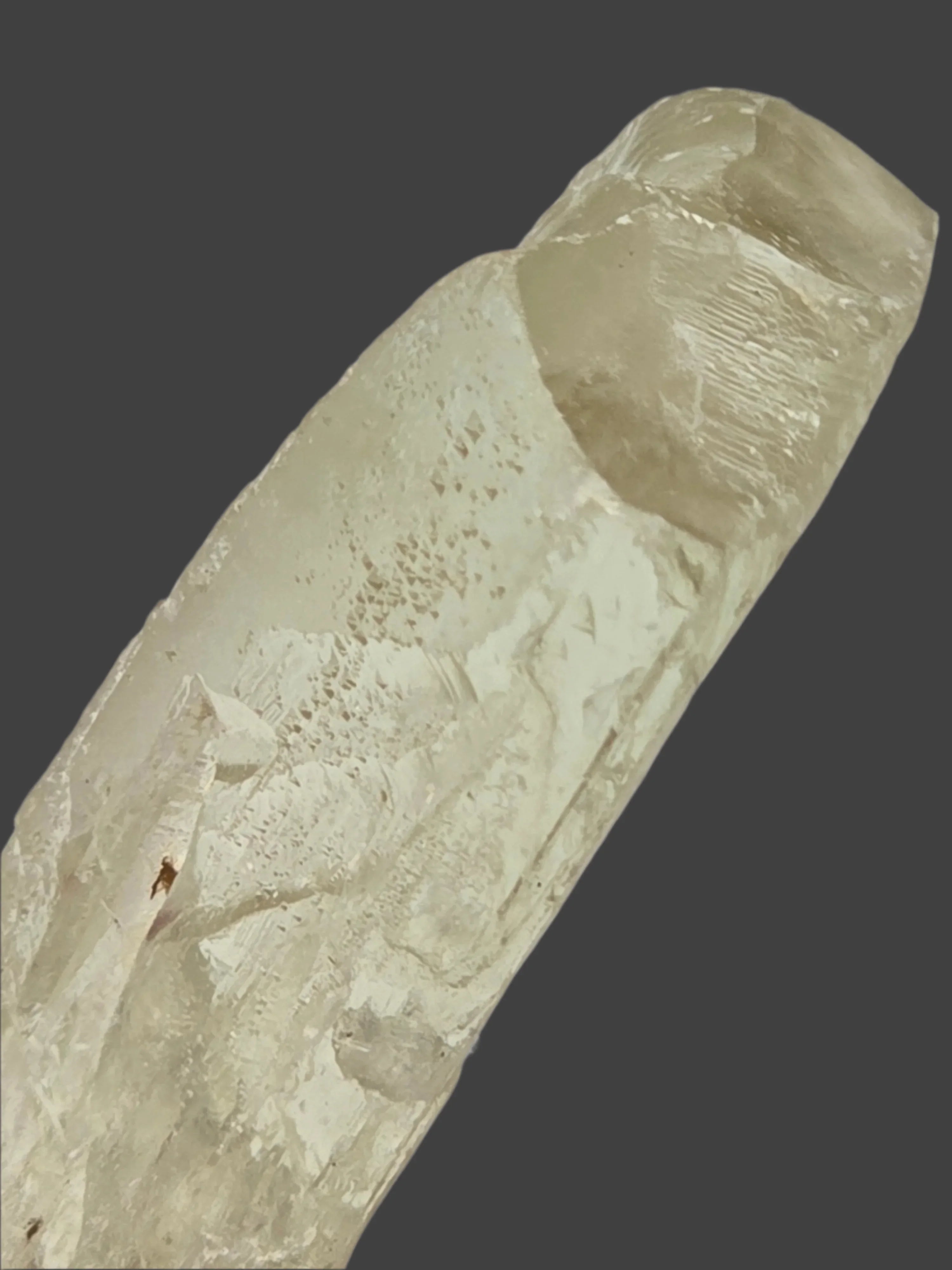 Quartz crystal specimen with natural striations and inclusions, ideal for mineral collectors