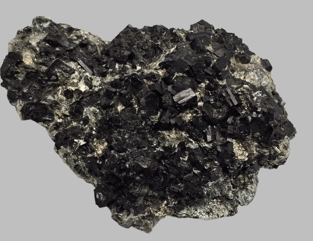 Black tourmaline crystal specimen with metallic matrix, mineral collector's display piece