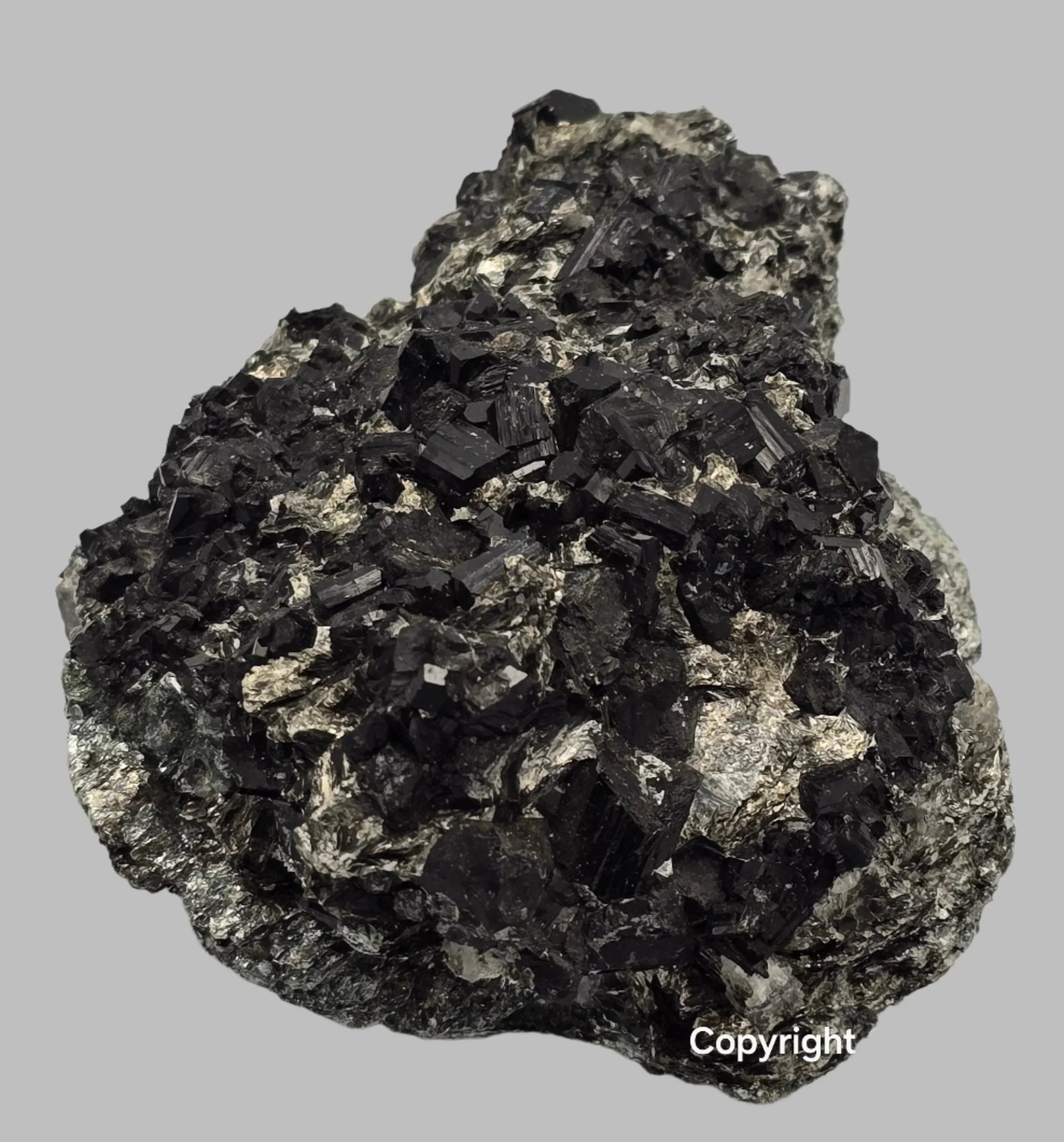 Hematite mineral specimen with metallic luster, classic iron oxide crystal formation on matrix