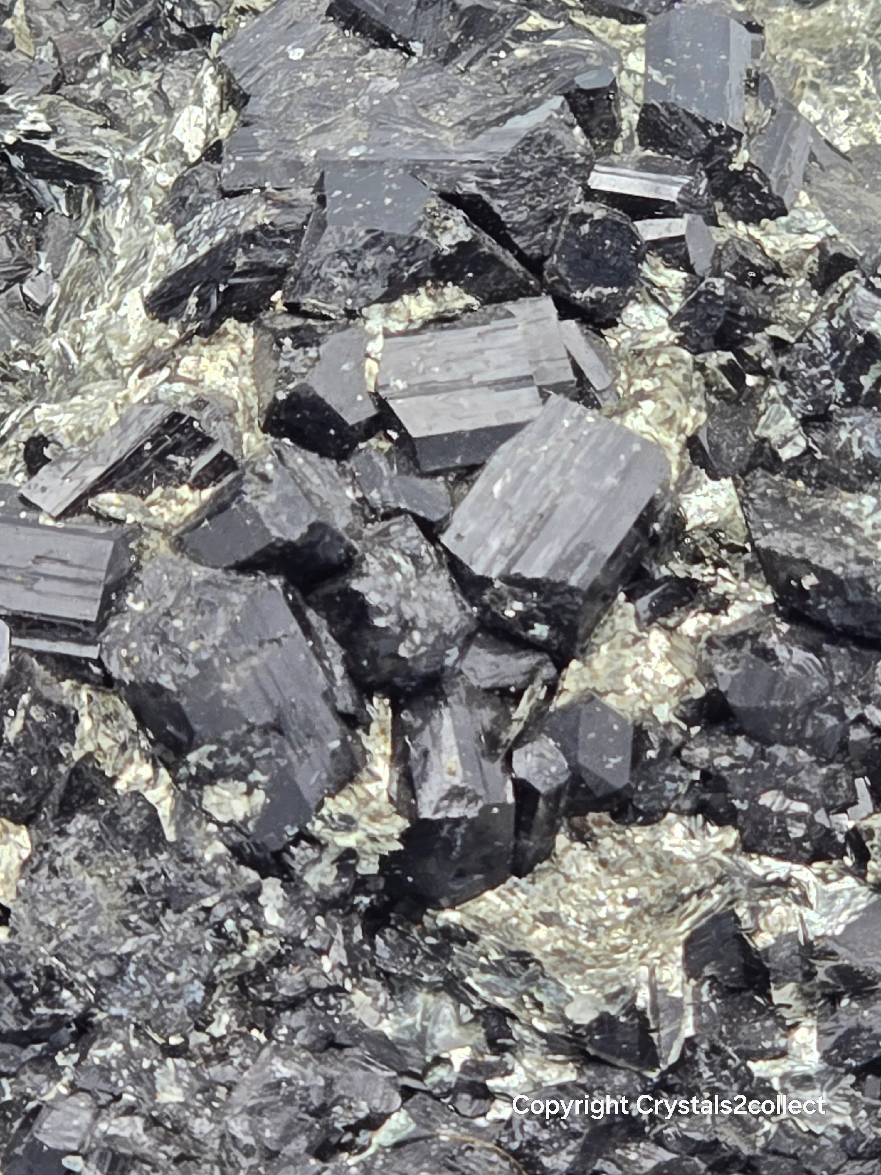 Hematite crystals with metallic luster, showcasing natural mineral specimens for collectors