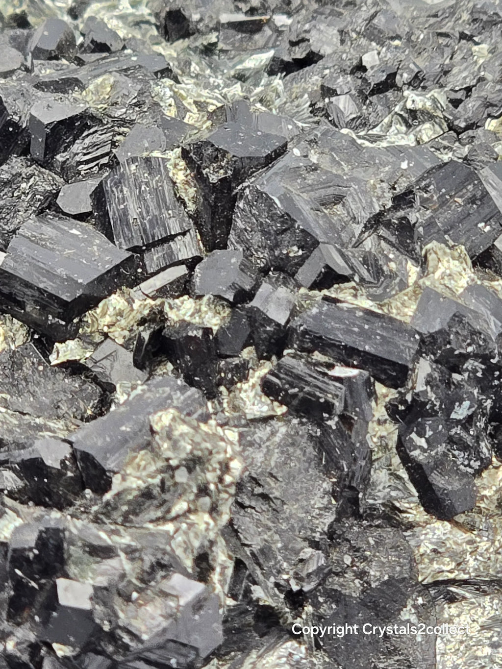 Hematite crystals with metallic luster, showcasing natural mineral formation and geological texture