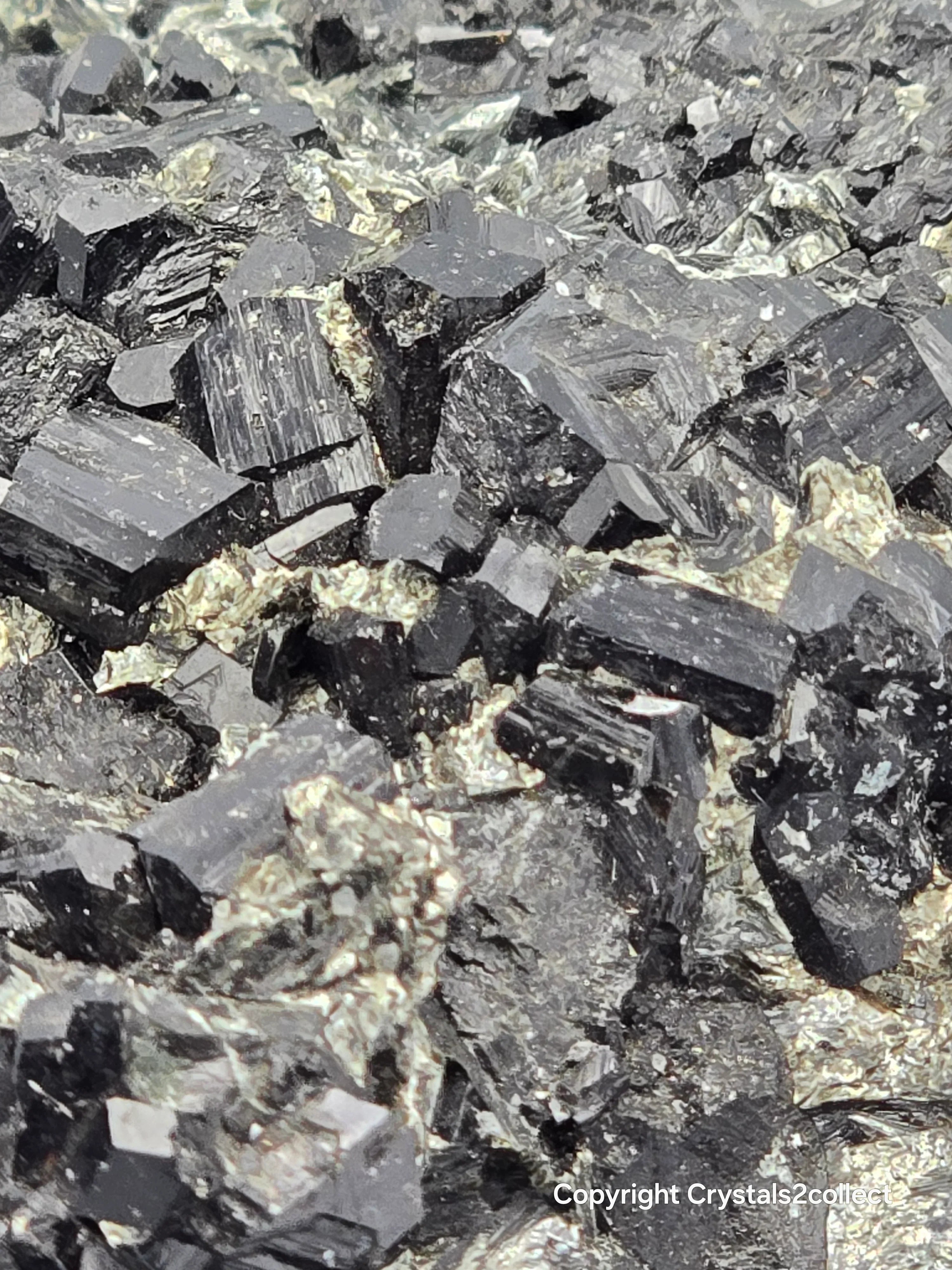 Hematite crystals with metallic luster, showcasing natural mineral formation and geological texture