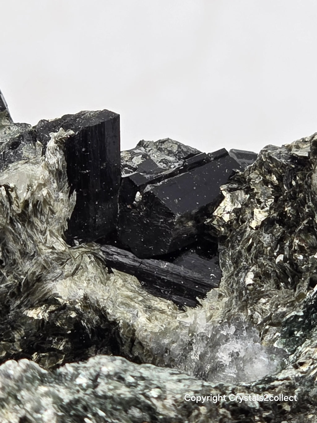 Black tourmaline crystal specimen with matrix, mineral collection for enthusiasts