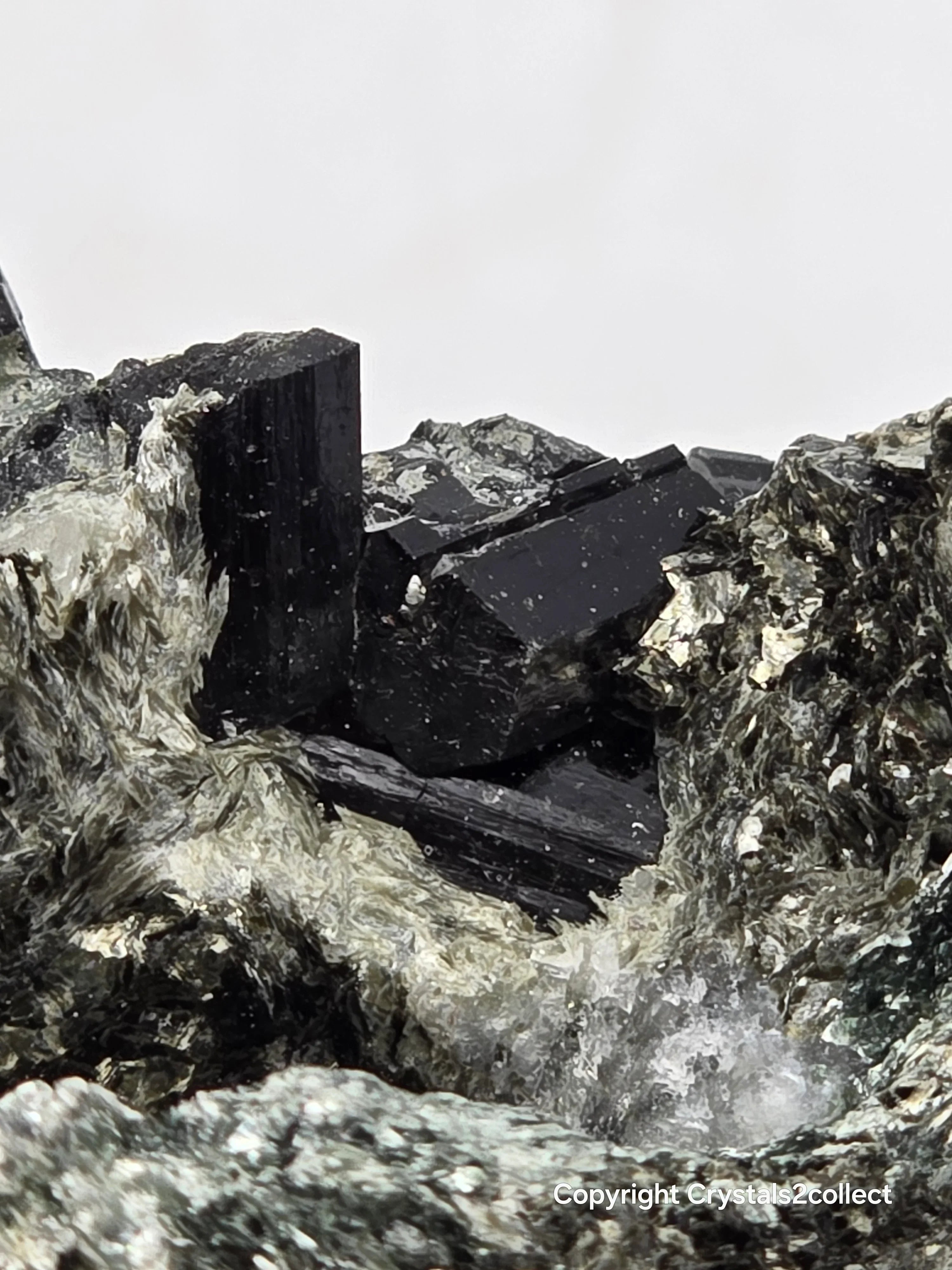 Black tourmaline crystal specimen with matrix, mineral collection for enthusiasts