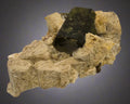 Dark green epidote crystal on beige matrix, classic mineral specimen for collectors