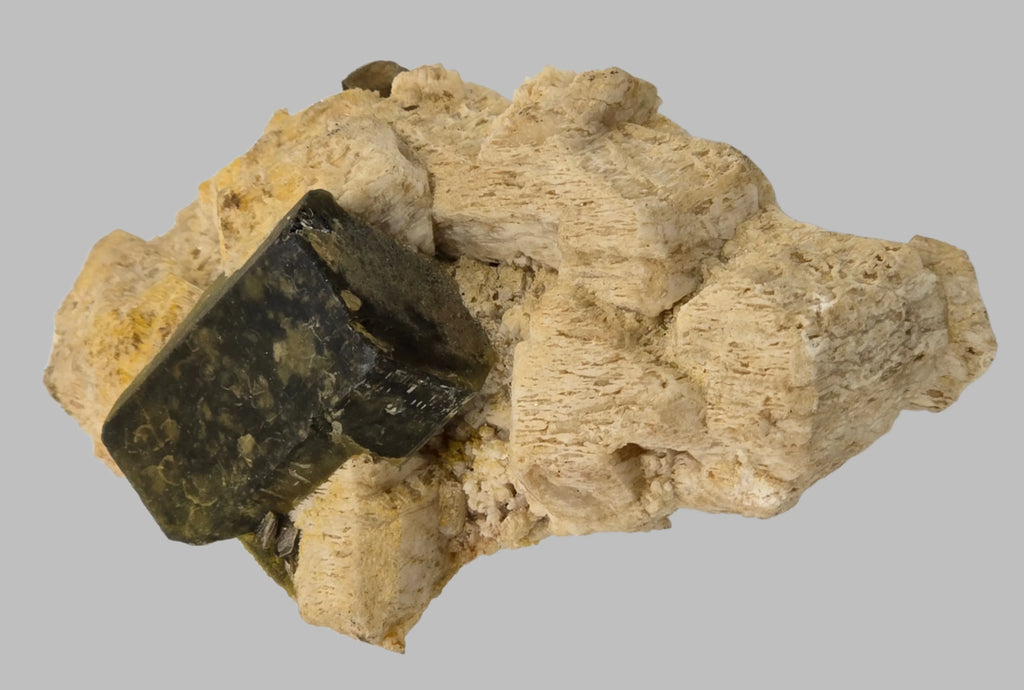 Dark green epidote crystal on light matrix, mineral specimen for collectors