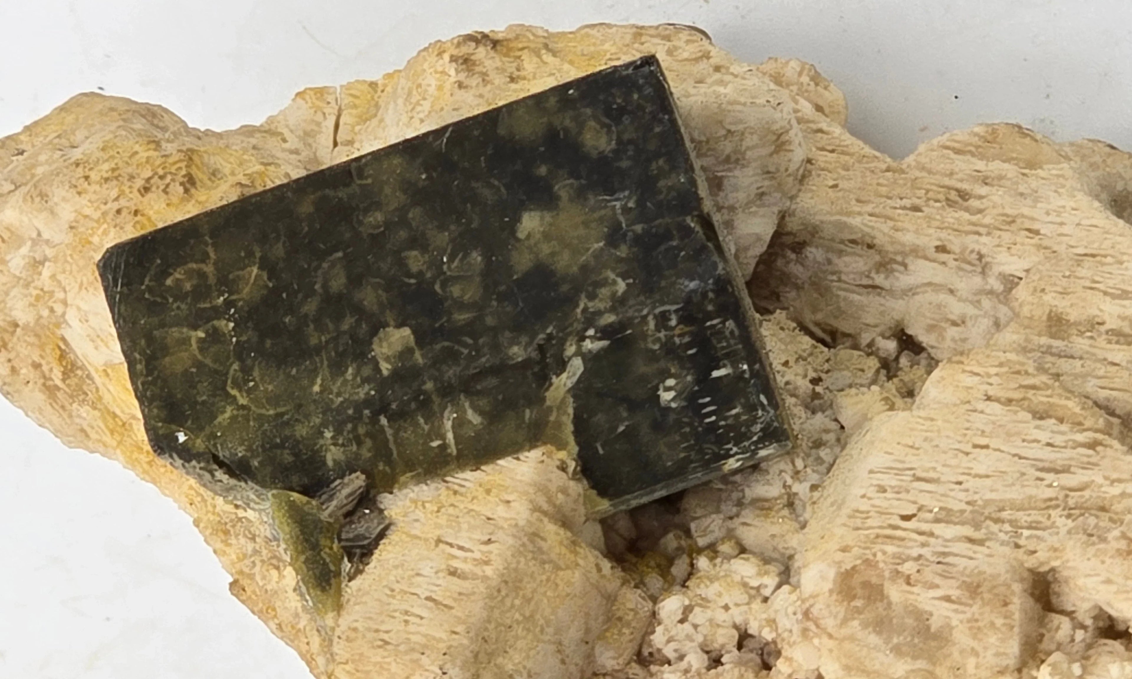 Polished black and green mineral specimen on matrix, ideal for collectors and geological study