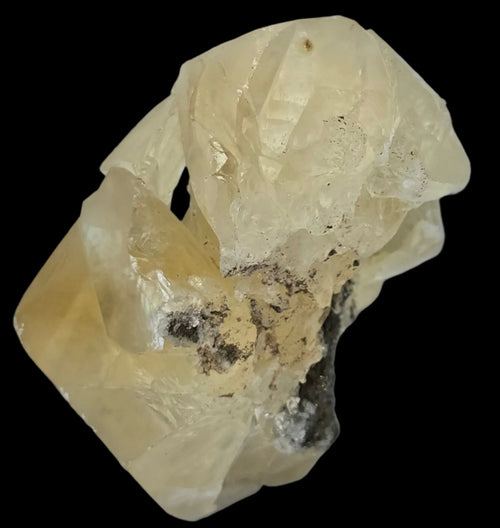 Calcite crystal specimen with yellowish hue and natural inclusions, ideal for mineral collectors