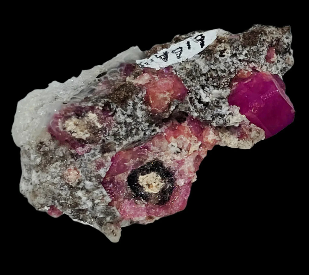 Rhodochrosite with striking pink crystals on matrix, classic mineral specimen for collectors