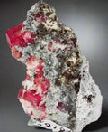 Vivid red rhodochrosite crystals on matrix, classic mineral specimen for collectors