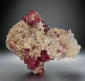 Ruby in marble specimen from Myanmar, vibrant red crystals on white matrix, mineral collector's piece