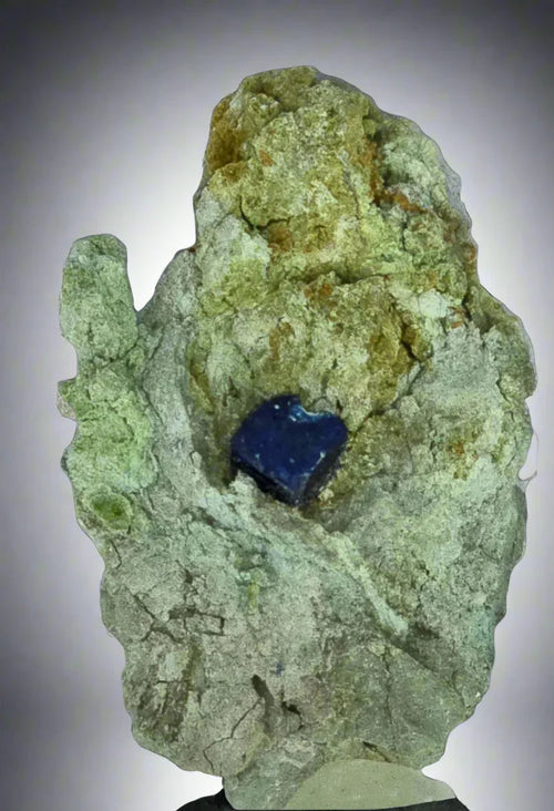 Vivid blue lapis lazuli crystal in green matrix, classic mineral specimen for collectors