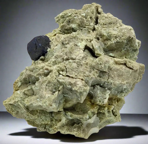 Fluorite on matrix from Derbyshire, UK — greenish rock with dark cubic crystal, mineral specimen for collectors