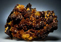 Wulfenite mineral specimen from Arizona, featuring vibrant orange crystals on dark matrix