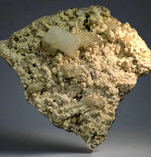 Calcite on Barite from Elmwood Mine, Tennessee - mineral specimen with creamy clusters and clear crystals