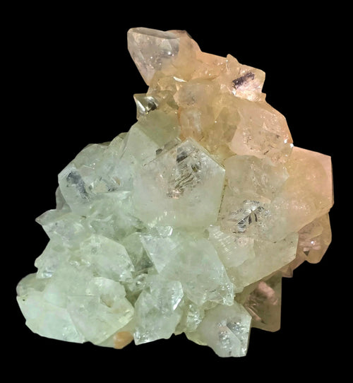Fluorite crystal specimen with green and yellow hues, showcasing natural mineral formation against black background