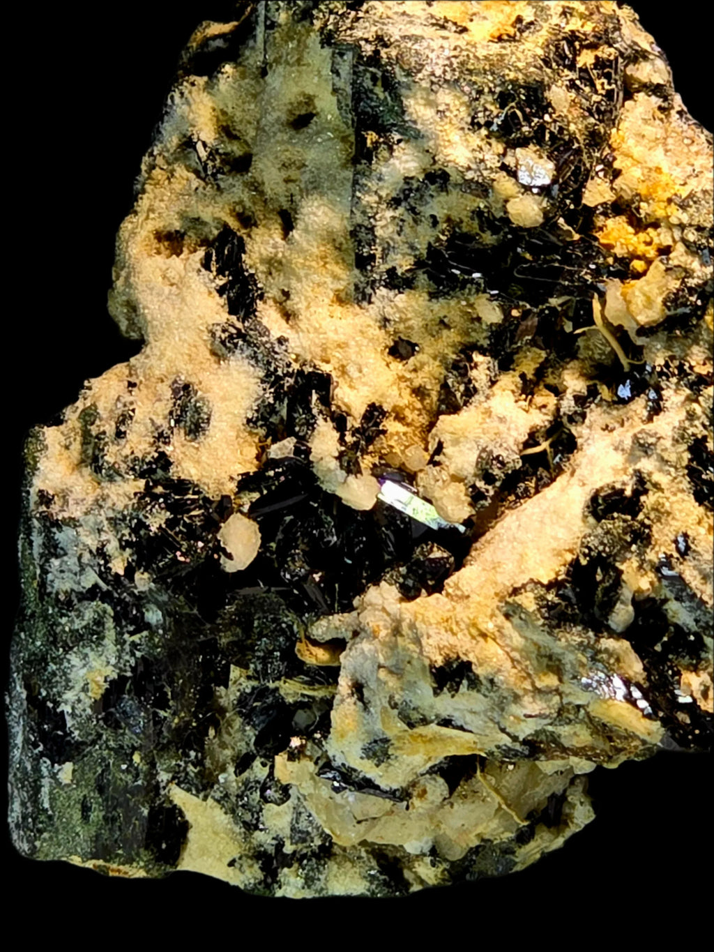 Epidote crystal specimen with green and black mineral inclusions from classic locality