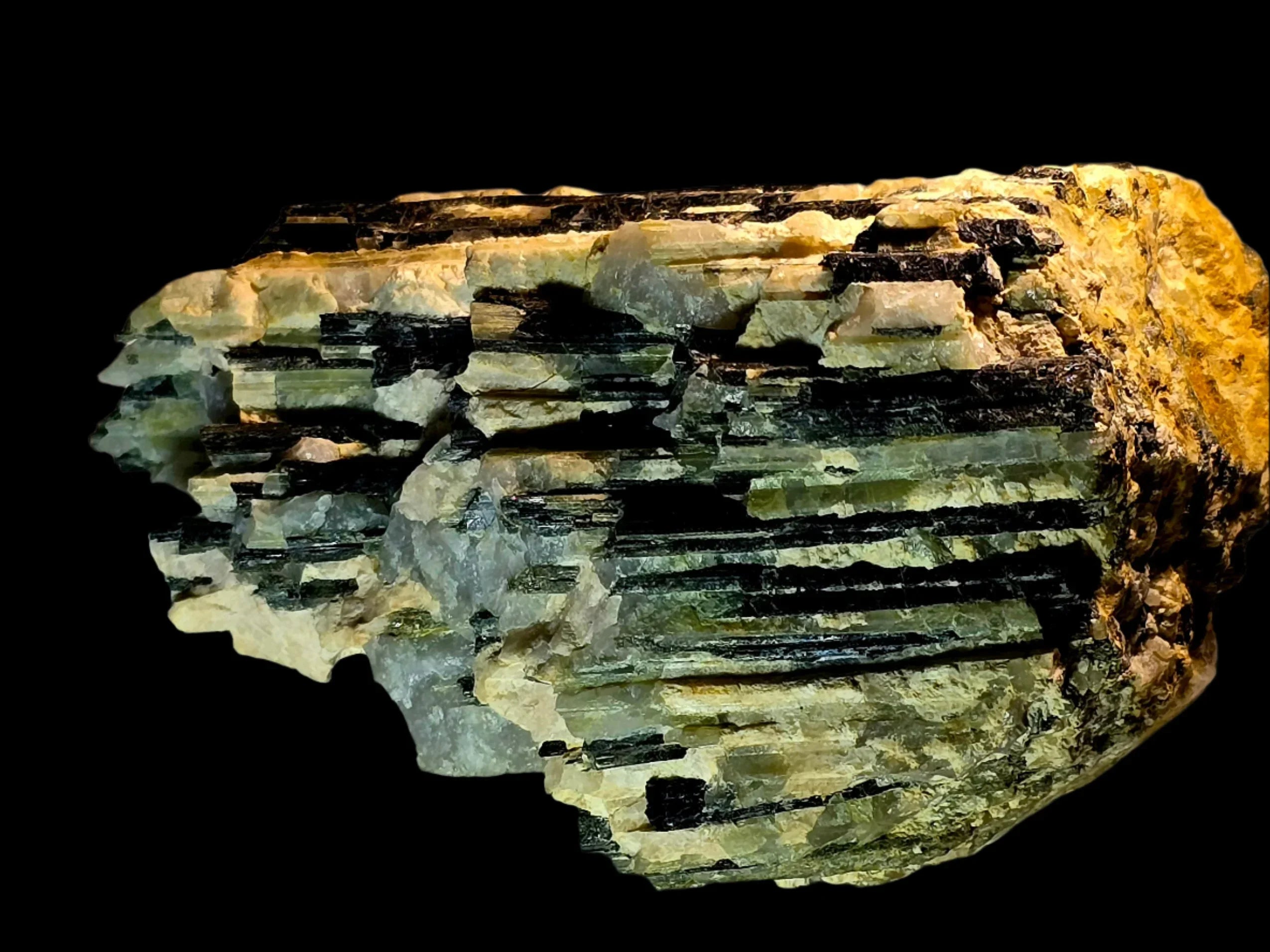 Biotite mica mineral specimen with layered green and black crystals on matrix, classic geological collectible