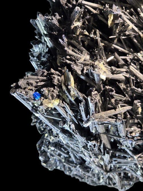 Stibnite with blue and yellow crystals, mineral specimen from classic locality