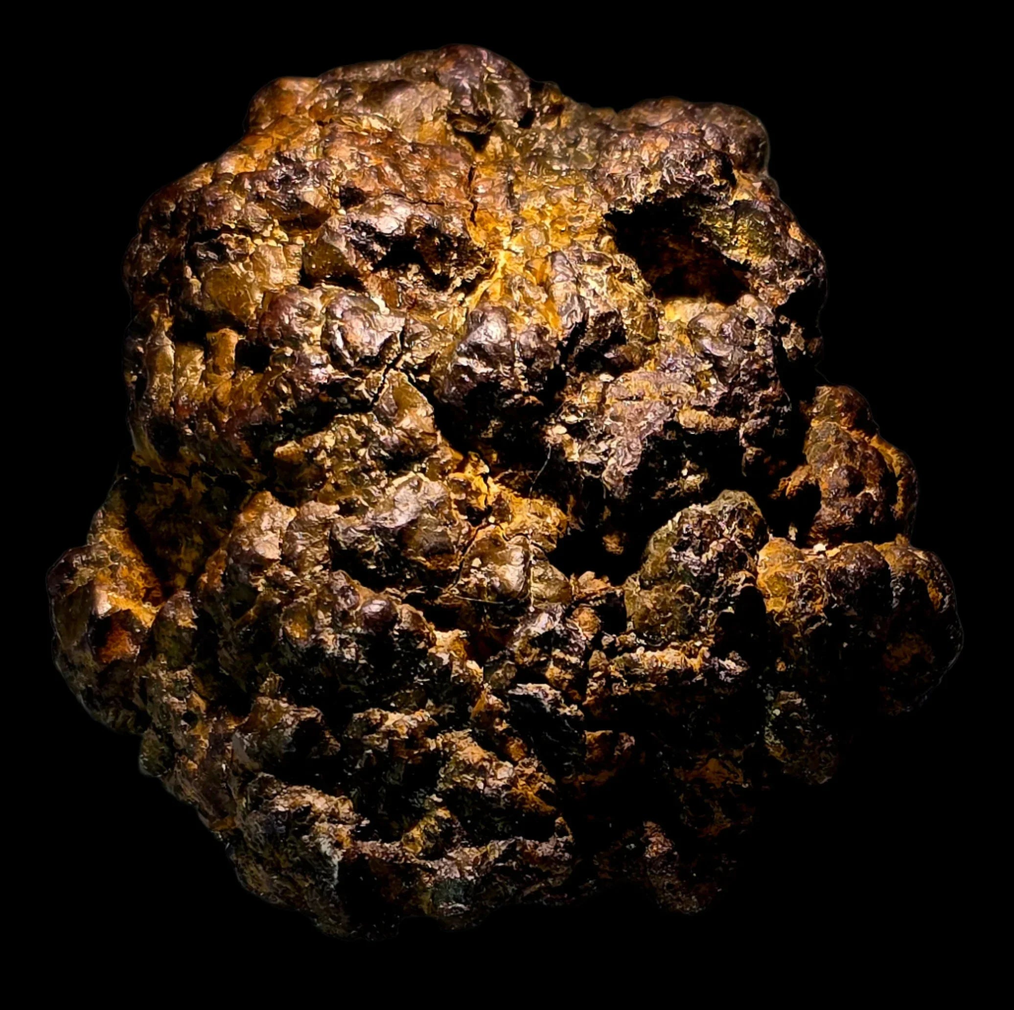 Pyrite mineral specimen with golden-brown metallic luster, rough textured crystal cluster against black background