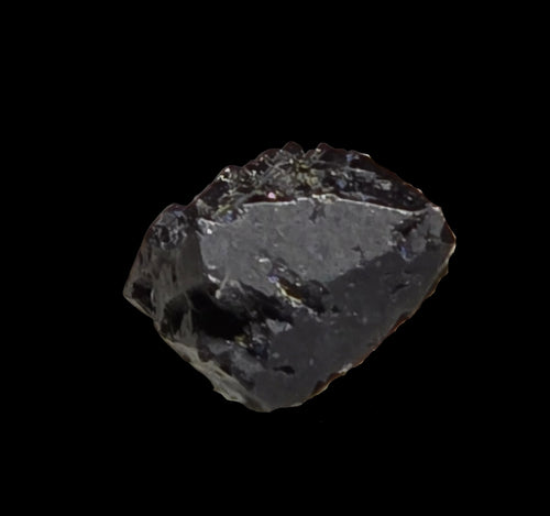 Obsidian mineral specimen with natural glassy texture and dark gray tones, ideal for collectors