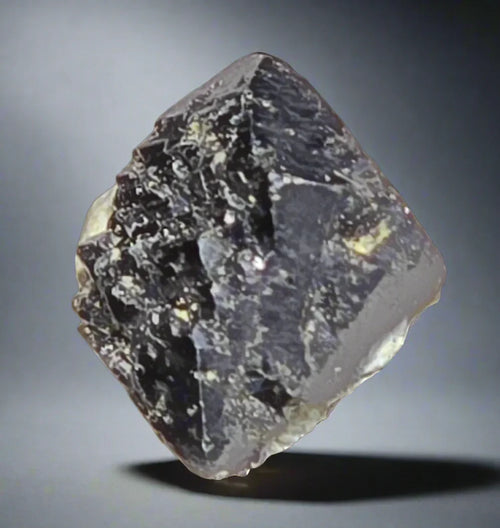 Fluorite crystal specimen from Derbyshire, UK - dark purple with white inclusions, geometric mineral formation