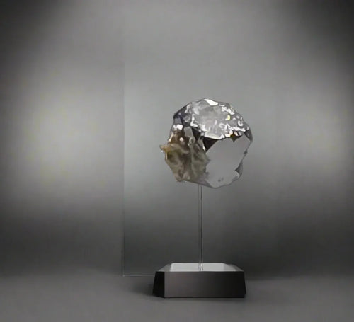 Quartz crystal specimen on acrylic stand, showcasing natural mineral formation and clarity