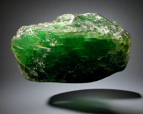 Vivid green emerald crystal specimen from Muzo, Colombia, showcasing natural clarity and rich coloration.