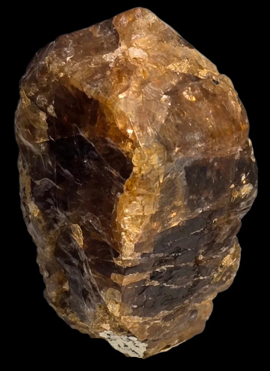 Citrine crystal specimen with golden-brown hues and natural facets, showcasing mineral clarity and earthy texture