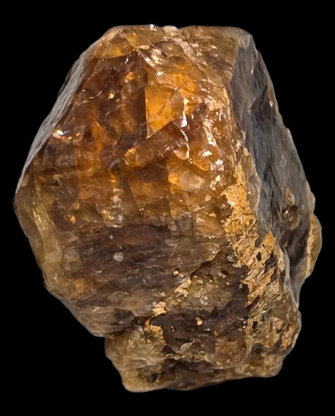 Topaz crystal specimen from Brazil, golden-brown mineral with natural facets and earthy matrix