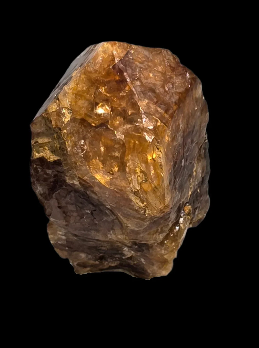 Citrine crystal specimen with golden amber hues, natural mineral formation against black background