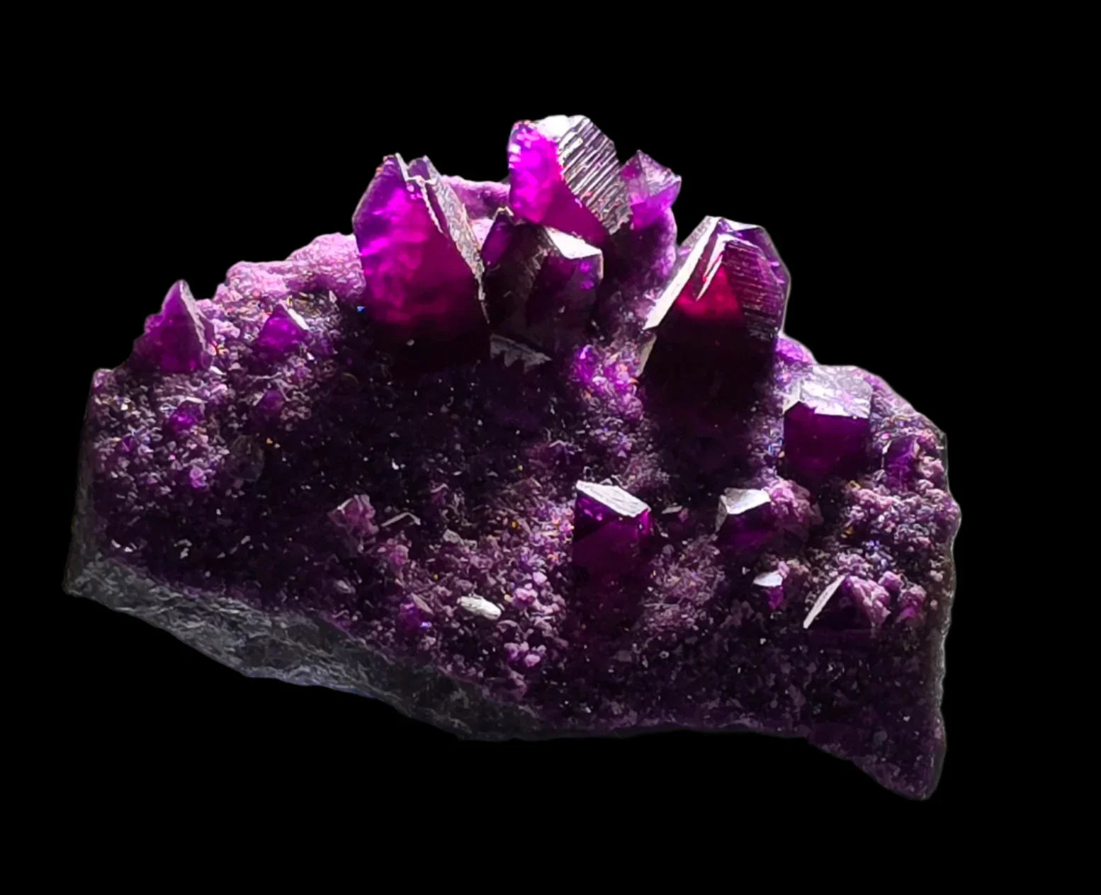 Fluorite crystal specimen with vibrant purple cubes on matrix, ideal for mineral collectors