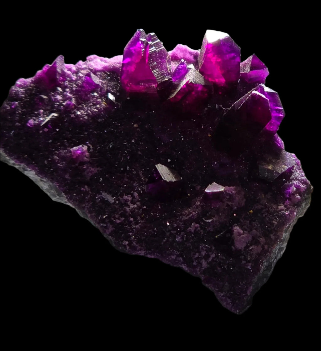 Vivid purple fluorite crystals on matrix, striking mineral specimen for collectors