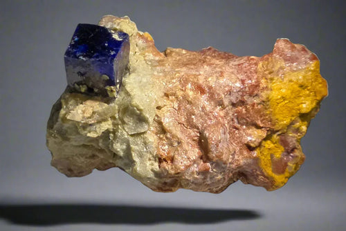 Vivid blue sodalite crystal on matrix, classic mineral specimen for collectors