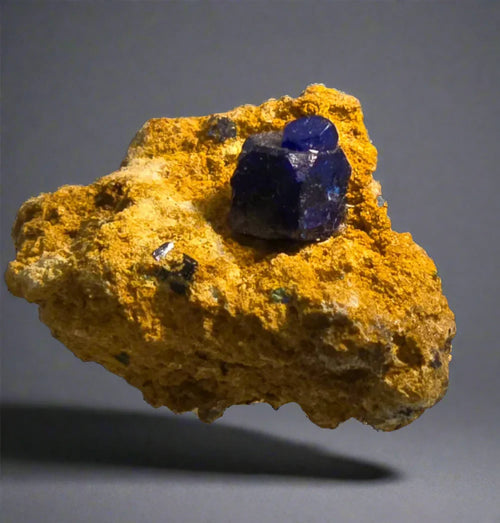 Vivid blue fluorite crystal on yellow matrix, classic mineral specimen for collectors