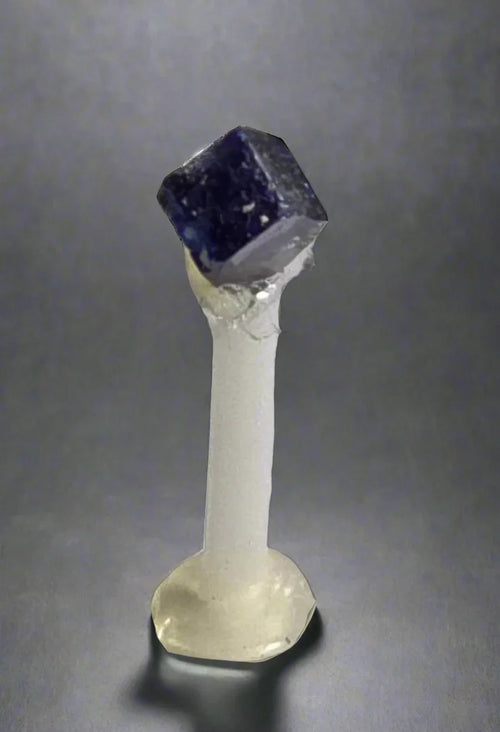 Fluorite cube on quartz stand, classic mineral specimen for collectors