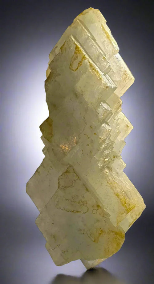 Fluorite crystal specimen with cubic growth, pale yellow hue, and natural inclusions