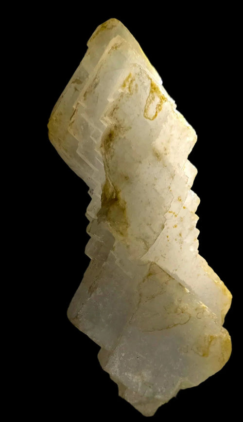 Fluorite crystal with stepped cubic growth, translucent white with yellow inclusions, mineral specimen