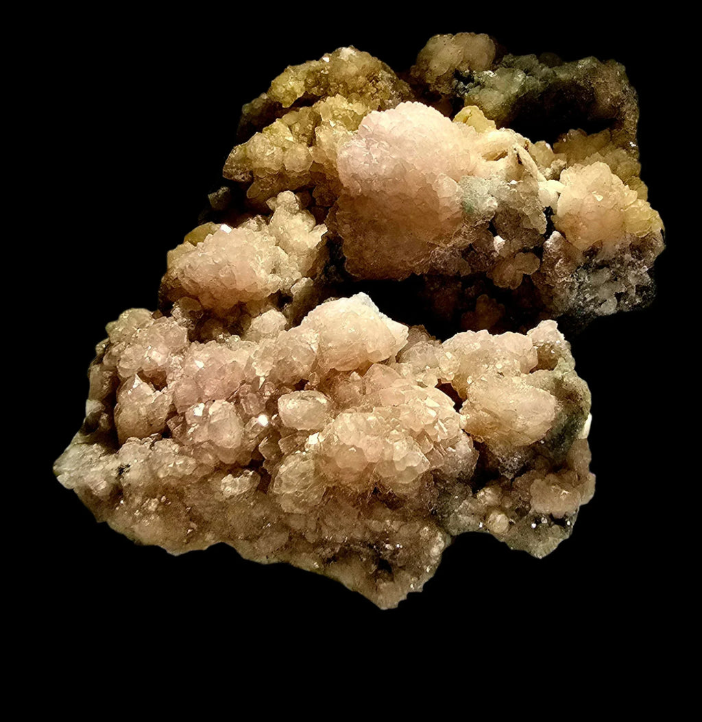 Heulandite crystal cluster from India, showcasing pinkish-white zeolite formations on dark matrix