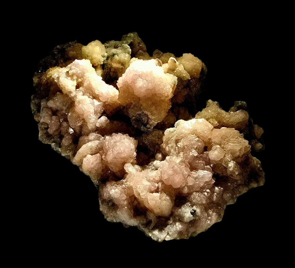 Heulandite mineral specimen with pink and yellow crystals on dark matrix, geological collector's item