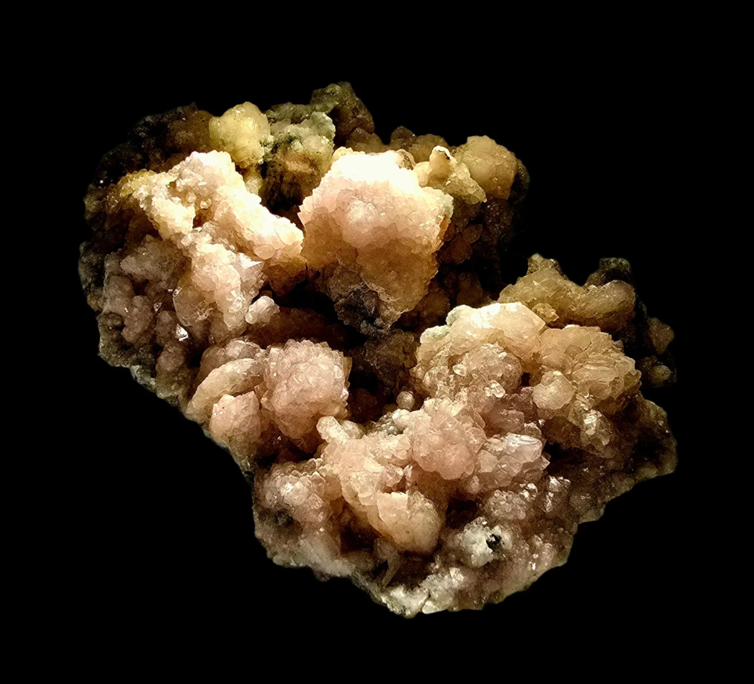 Heulandite mineral specimen with pink and yellow crystals on dark matrix, geological collector's item