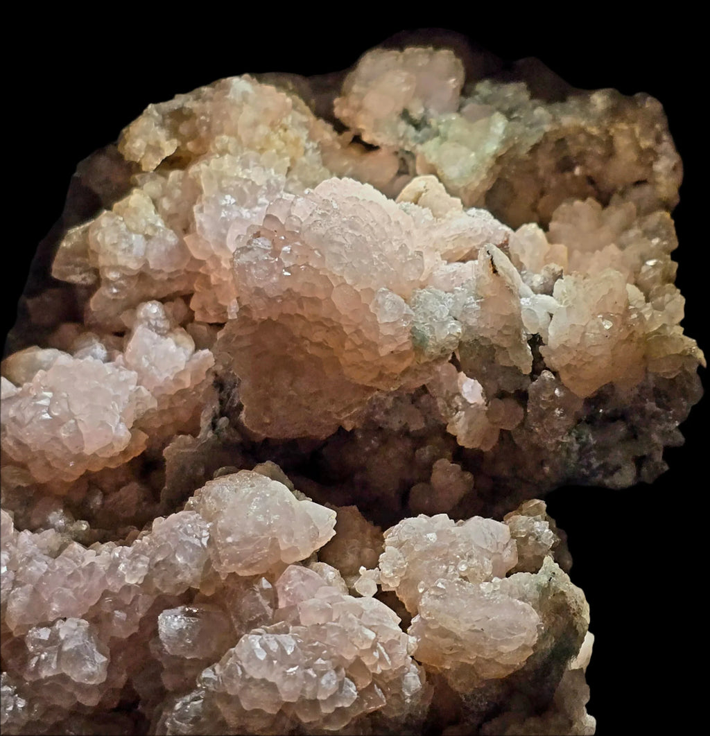 Heulandite mineral specimen with pinkish-white crystals on dark matrix, classic locality