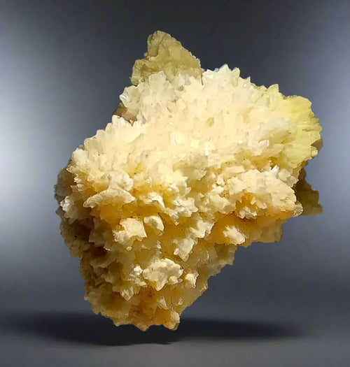 Calcite crystal specimen from Elmwood Mine, Tennessee, featuring vibrant yellow clusters and sharp mineral formations