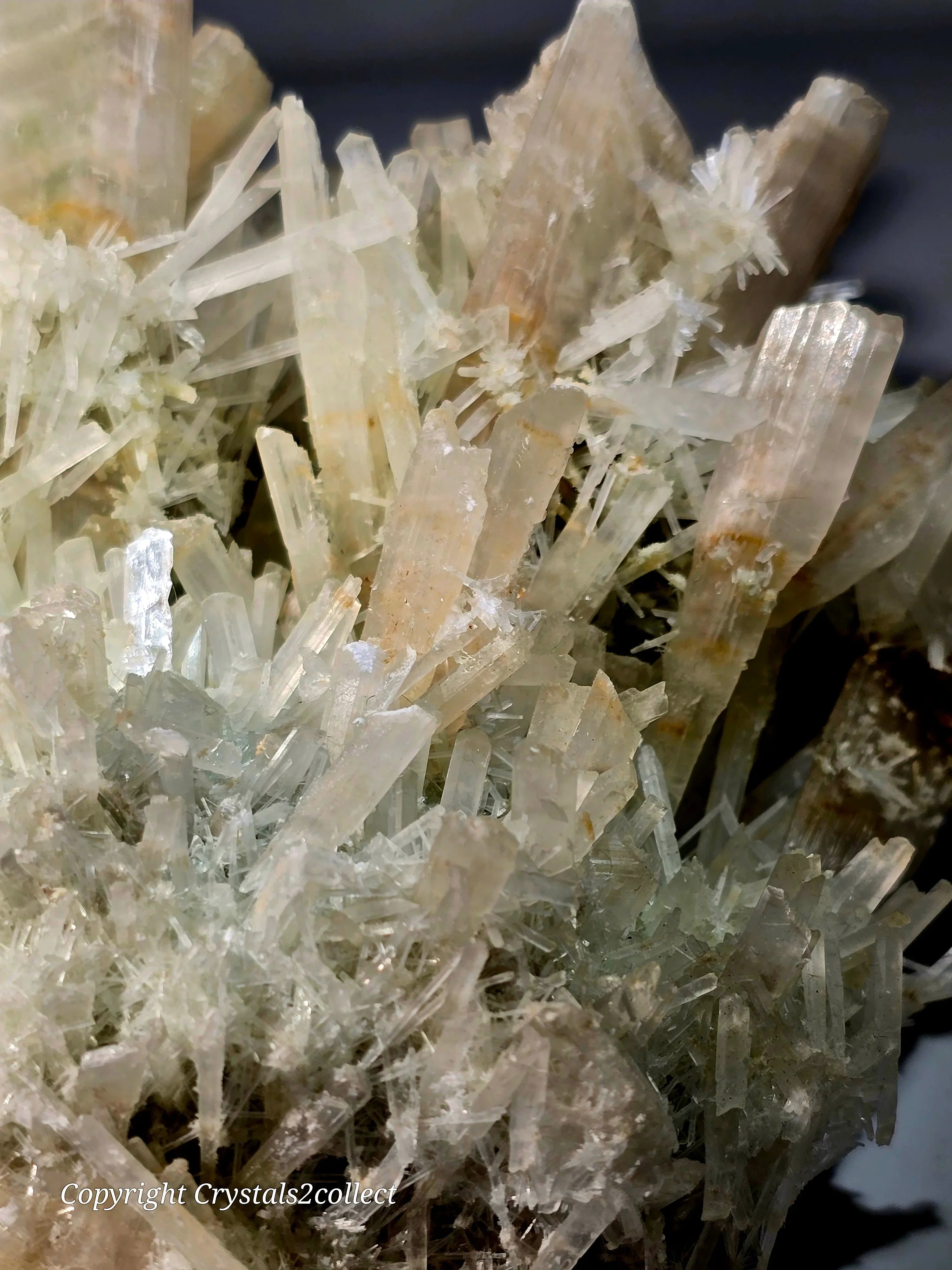 Calcite crystals with needle-like formations, translucent white with earthy tones, mineral specimen for collectors