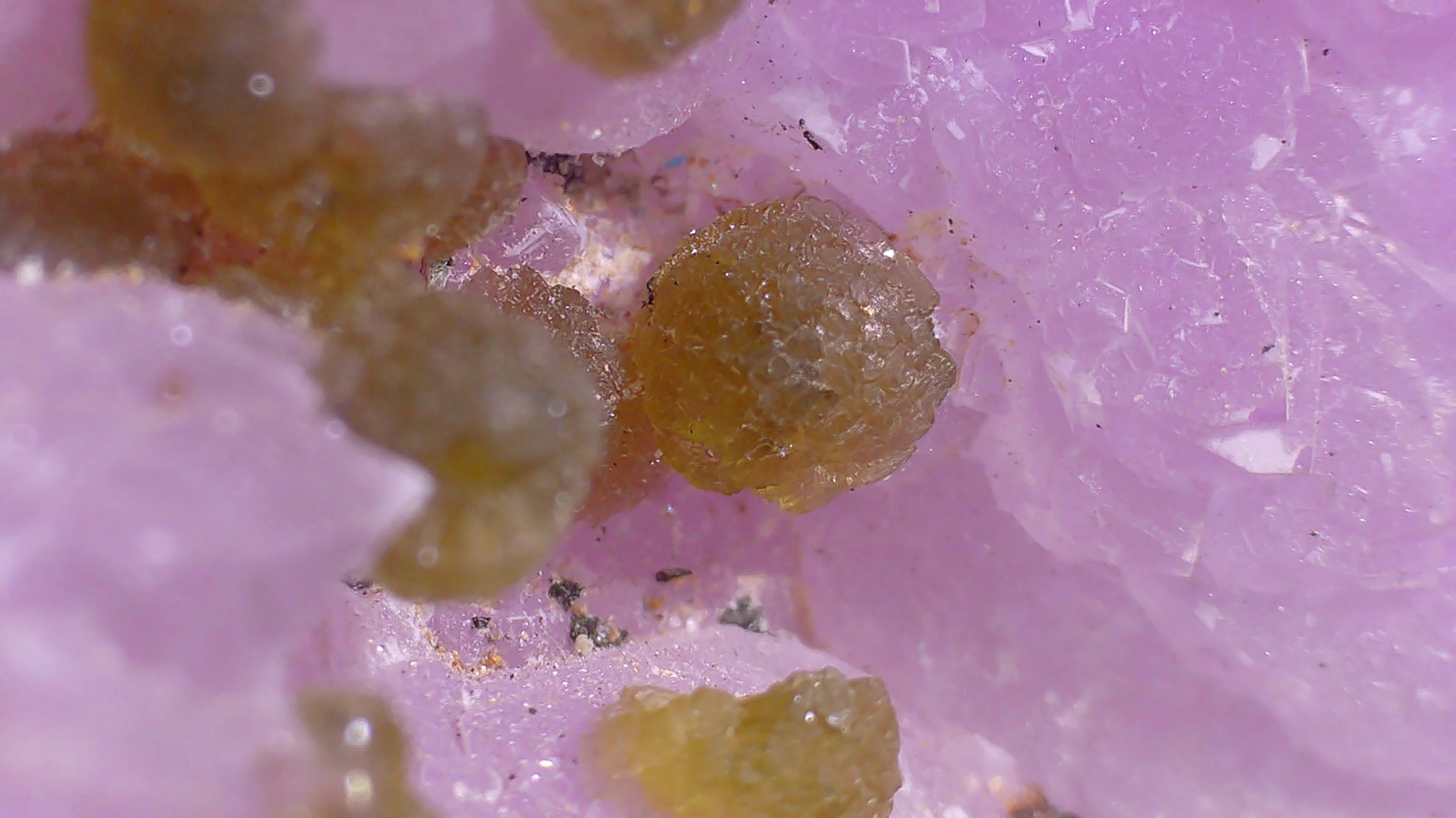 Amethyst with yellow calcite crystals, showcasing natural mineral formations