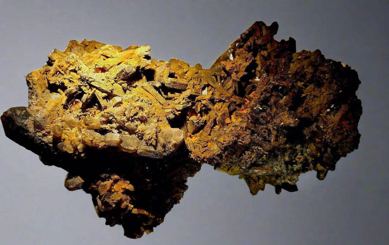 Wulfenite specimen from Arizona, featuring vibrant orange crystals on dark matrix, ideal for mineral collectors.