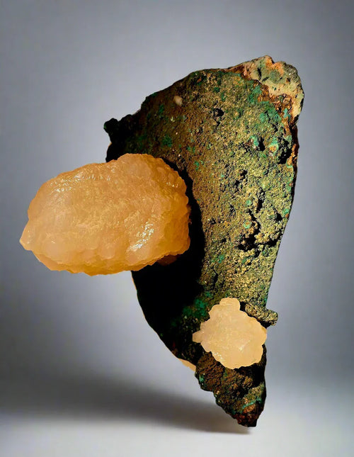 Calcite on Malachite specimen from Tsumeb, Namibia — vibrant orange calcite crystals on green matrix