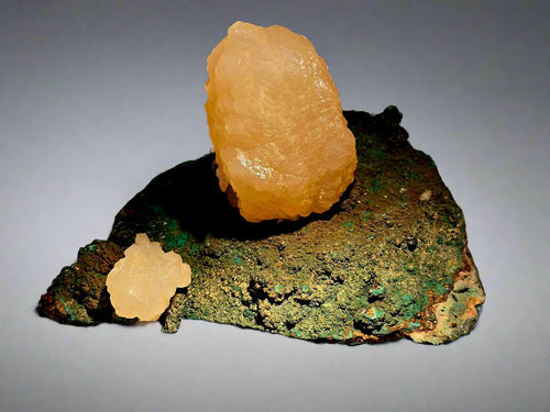 Calcite on Malachite matrix from Tsumeb, Namibia - mineral specimen with golden-yellow crystals